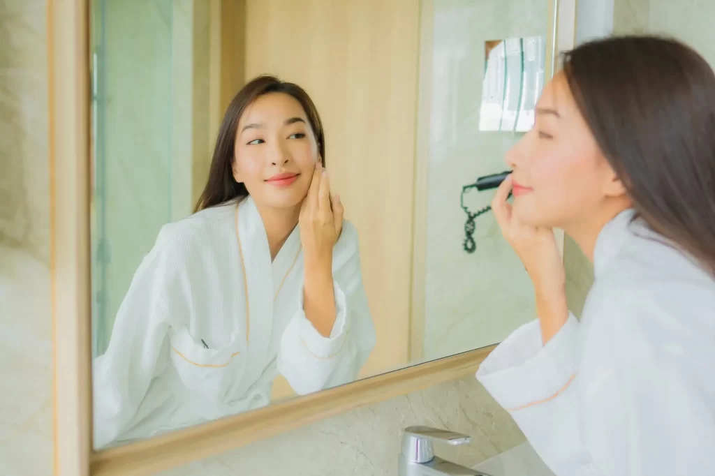 woman applying skincare routine for dry skin